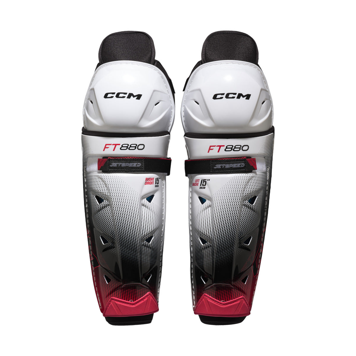 Jambières de hockey CCM JETSPEED FT880 pour adultes, blanc et noir, vue de face de la paire avec coques de genou
