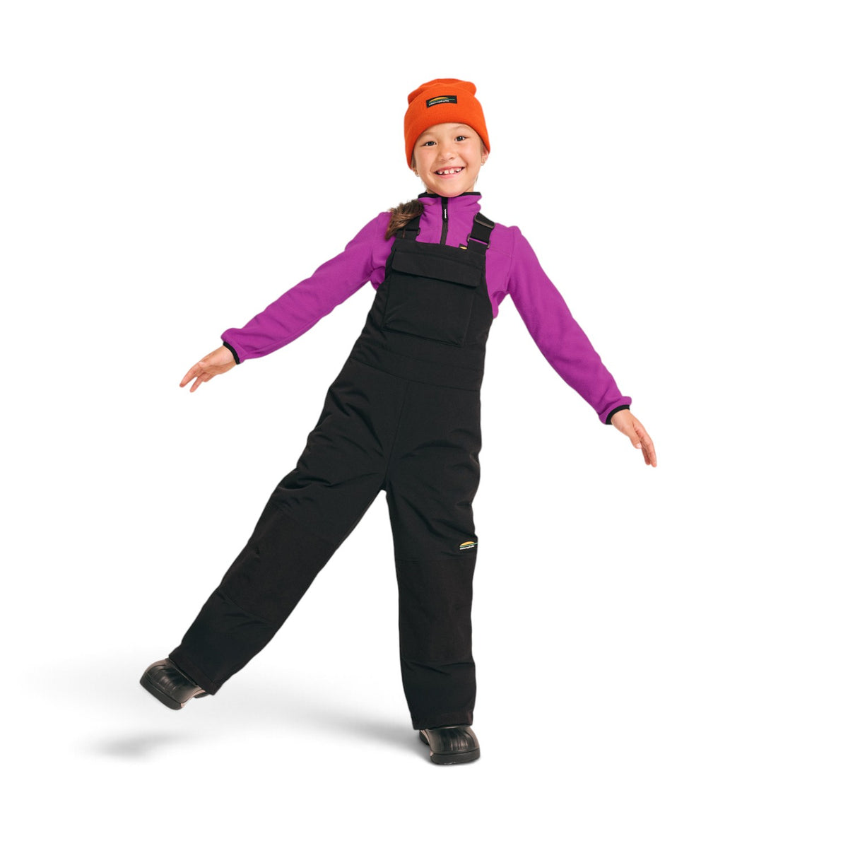 Enfant portant la salopette d'hiver noire Chlorophylle JR WILLOW, vue de face