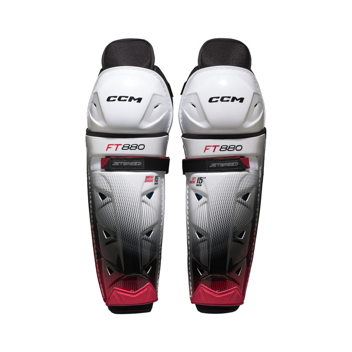 Jambières de hockey CCM JETSPEED FT880 pour juniors, blanc et noir, vue de face de la paire avec coques de genou