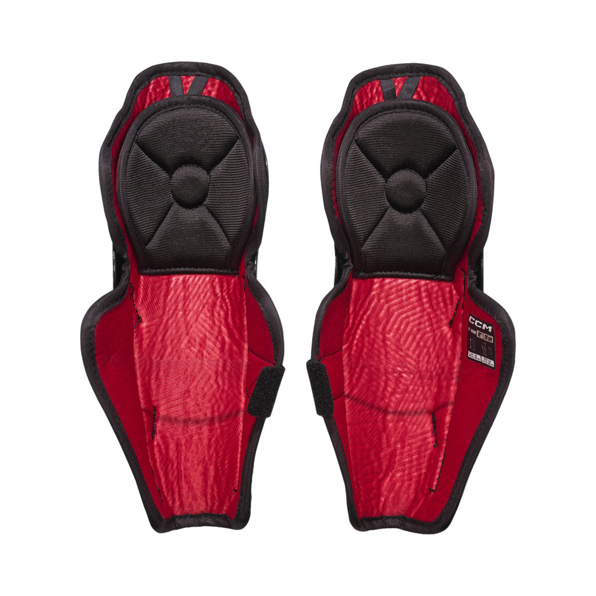 Jambières de hockey CCM Next 26 pour petits enfants, vue de l'intérieur de la paire avec doublure et sangle à velcro