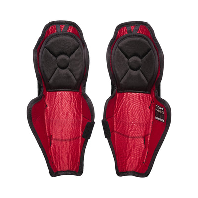 Jambières de hockey CCM Next 26 pour petits enfants, vue de l'intérieur de la paire avec doublure et sangle à velcro