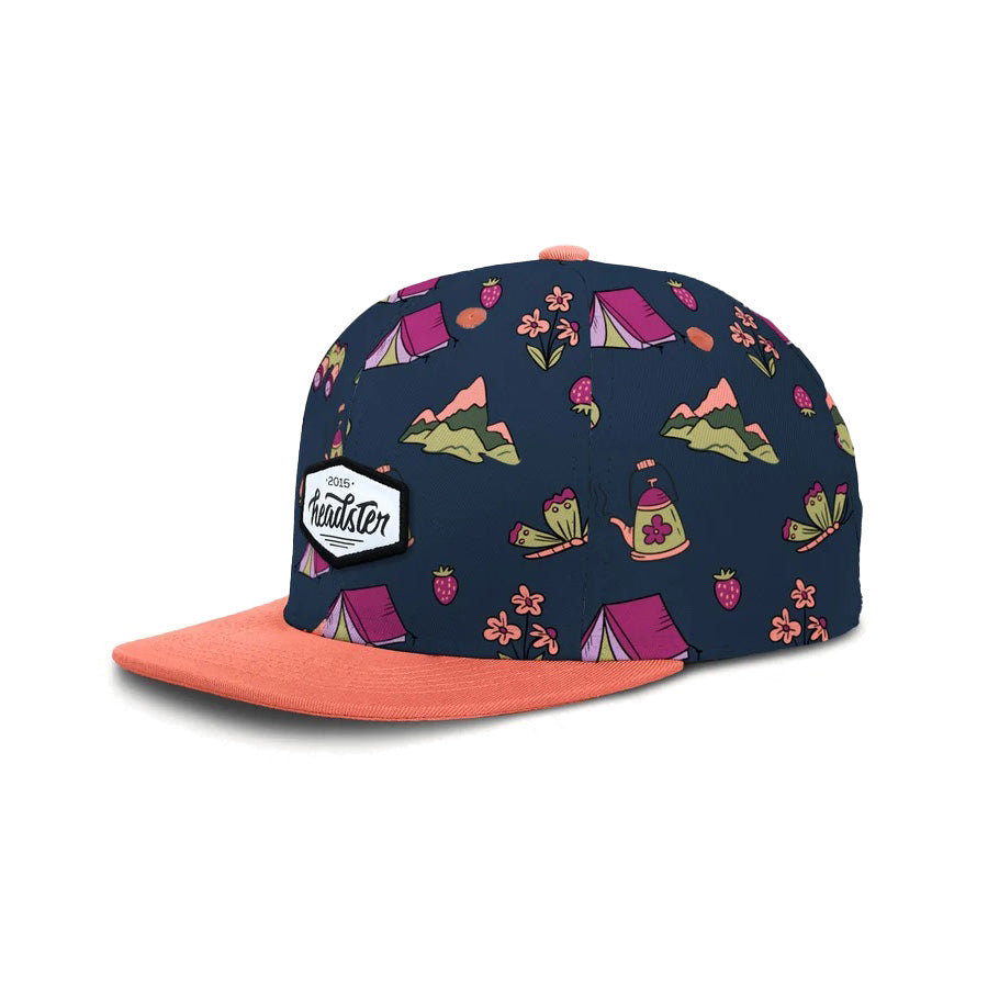 Casquette snapback Headster Midnight Meadow pour filles juniors, bleu marine à motif de camping, visière corail, vue de côté